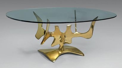 VICTOR ROMAN (1937-1995) Table, le piètement en bronze doré poli figurant un masque...
