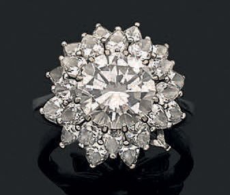 null Bague en or gris 18K (750) ornée d'un diamant taillé en brillant dans un double...