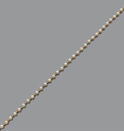 null Collier et bracelet de perles de culture alternées de billettes d'or 18K (750),...