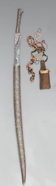  Large North African yatagan, repoussé silver handle with small ears decorated with...