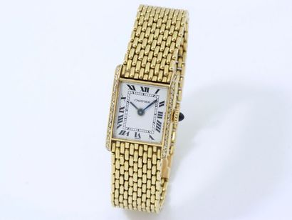 null CARTIER
Montre bracelet de dame en or 750 millièmes, cadran rectangulaire blanc...