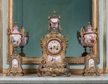 null Chased bronze and porcelain fireplace insert with pink background. The clock...