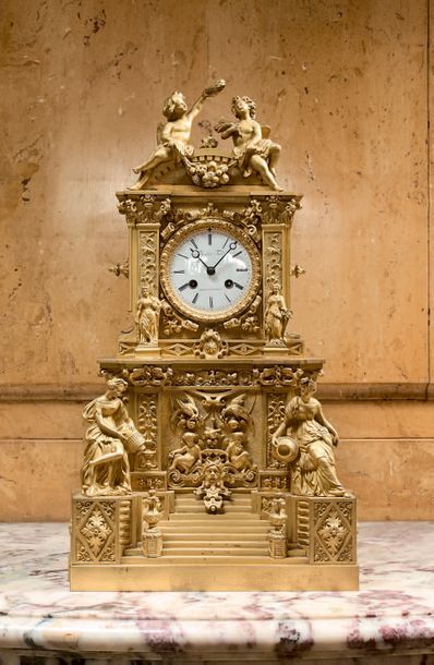 Chased and gilded bronze clock, with an architectural...