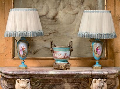  Pair of porcelain vases in the Sèvres style with gold reserves and painted with...