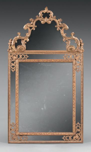 null Mercury mirror in a frame with glazing beads with a bérain decoration adorned...