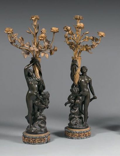 Pair of four-light candelabra in chased,...