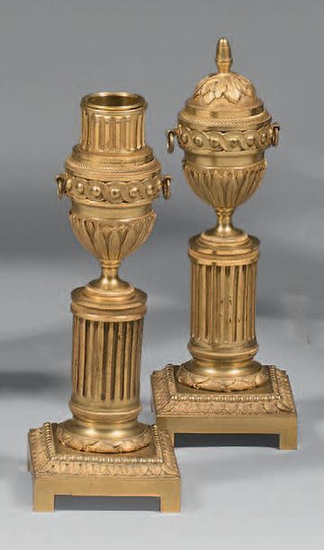 Pair of candleholders in chased and gilded...