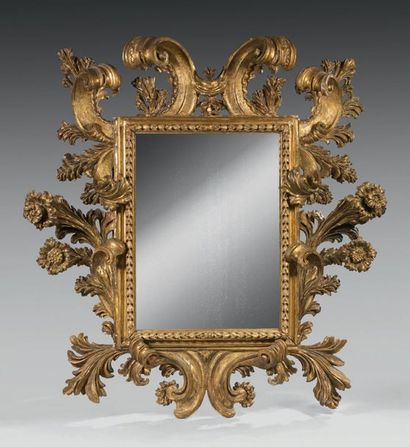 null Important "silver" mirror in a baroque frame in carved and gilded wood with...