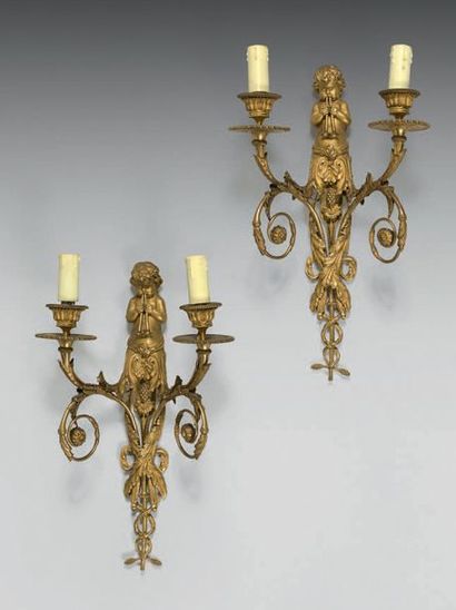 null Pair of wall lights with two lights in chased and gilded bronze; the putti plates...