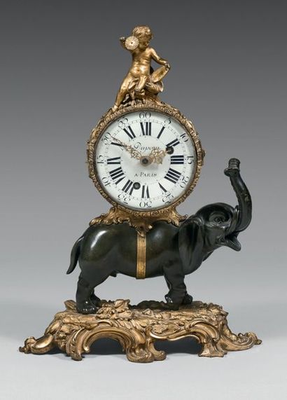  Elephant clock in chased bronze, gilded or patinated; Cupid's damping holding a...