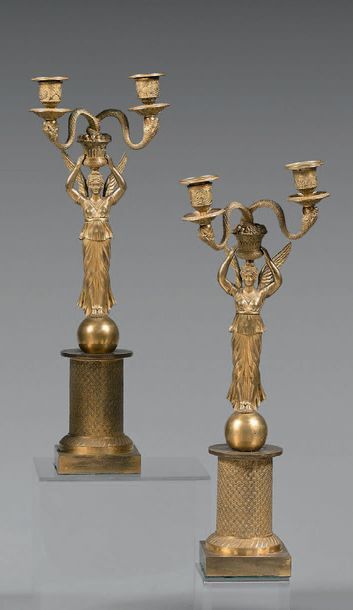 null Pair of candelabra with two chased bronze lights, knurled and gilded, in the...