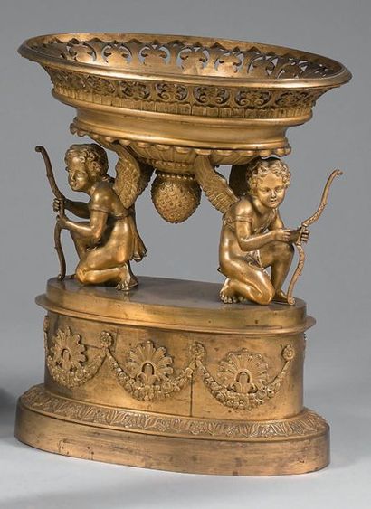  Basket of especially in finely carved and gilded bronze; the openwork basket with...