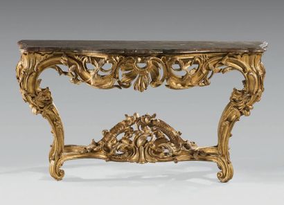 null Large four-legged console in carved and gilded wood; the openwork belt with...