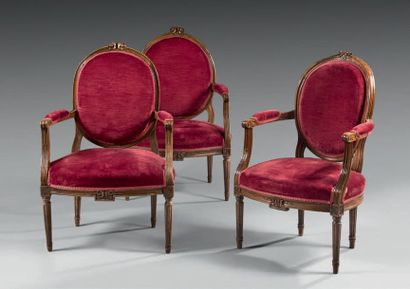 null A combination of three armchairs with medallion backrests, including a convertible...