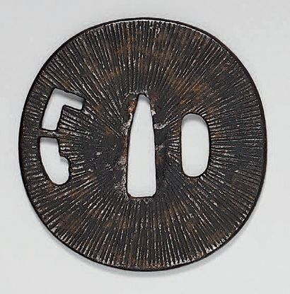 null Set of three iron Tsuba (landscape decoration, sheaves of plants, radiant background).
One...