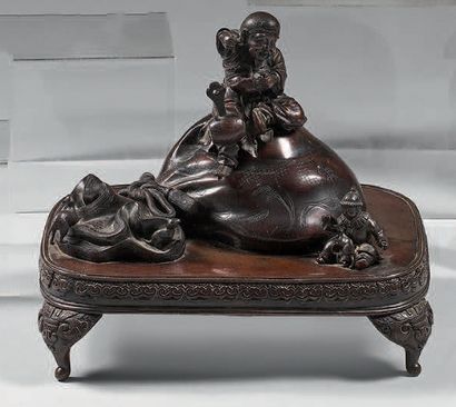 JAPON A large bronze perfume burner with a brown patina, in the shape of a Daikoku...