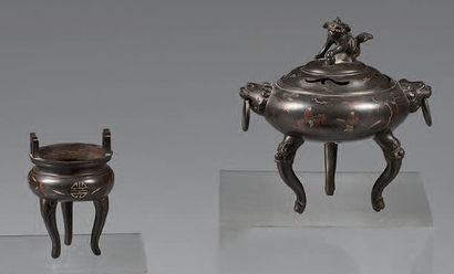 INDOCHINE Two tripod perfume burners, one covered, in brown patina bronze with red...