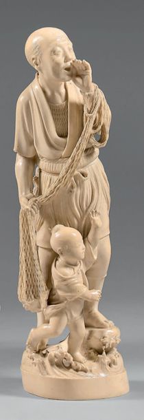 JAPON Okimono in ivory, fisherman with a child, standing on a rock coming out of...