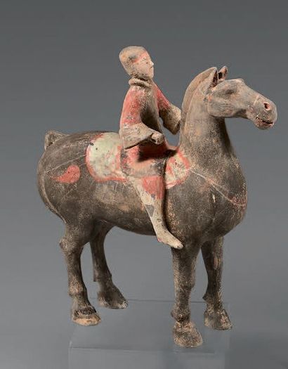 CHINE Statuette of a standing rider in black terracotta with traces of polychrome,...
