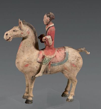 CHINE Statuette of a standing rider in beige terracotta with traces of polychrome,...