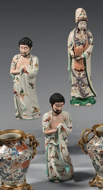JAPON A series of three large porcelain figurines representing the goddess Kannon...