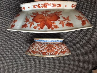 CHINE Two oval porcelain cups decorated in iron red with lotus flowers and shou symbols...