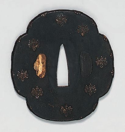 null Set of 3 Tsuba, 2 in openwork iron and one in shakudo decorated with paulownia...
