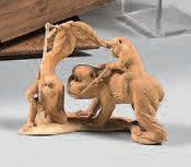 JAPON Carved ivory Okimono representing three monkeys, one perched on the back of...