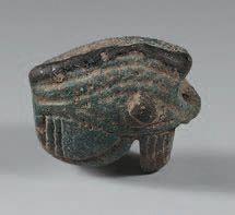 null Package including an eye oudjat and two amulets scarab.
Turquoise earthenware...