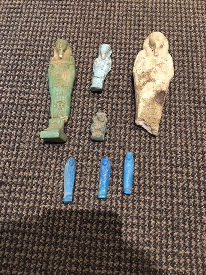 null A set of six oushabtis, two of which are inscribed and a Thoth amulet in the...