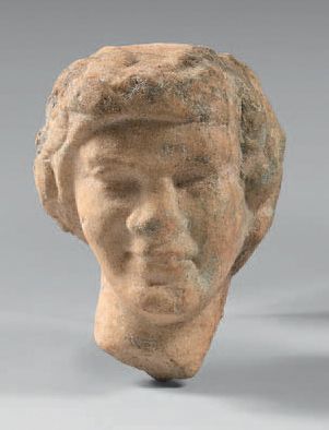 null Unfinished male head wearing a ivy crown.
It is probably a bacchus.
Marble....