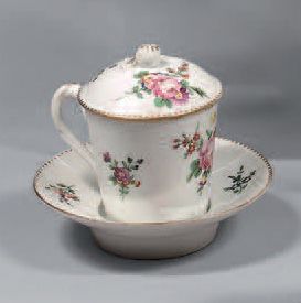PARIS A sunken cup and its truncated conical-shaped "shaker" saucer covered in porcelain...
