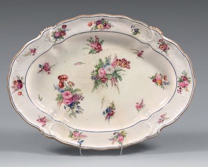 SÈVRES Large oval dish in soft porcelain decorated with foliage in slight relief...