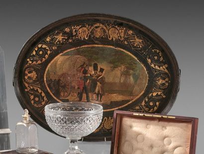 null Oval tray with a high rim in painted sheet metal and gold leaf decoration; it...