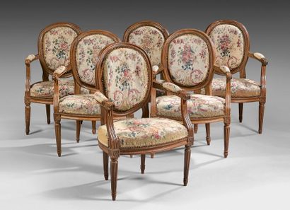 null Suite of six armchairs with medallion backrests in molded and carved beech cabriolets....