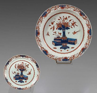 DELFT Dish with contoured rim and earthenware plate, decorated in the imari palette...
