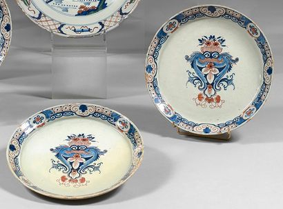 DELFT Three plates and one earthenware dish decorated with blue and red floral basket...