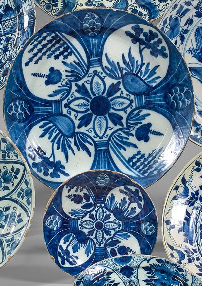 DELFT Large circular dish and earthenware plate with blue monochrome decoration of...