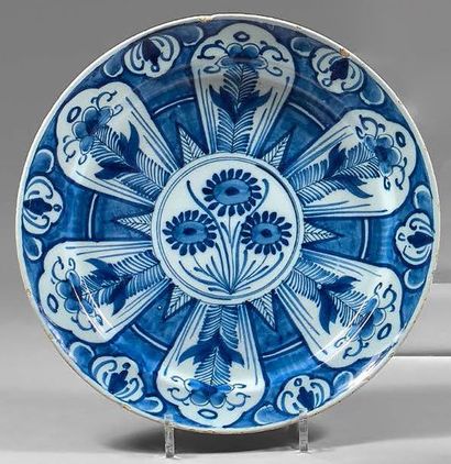 DELFT Earthenware dish in blue monochrome with flowers in cartridges. It bears a...