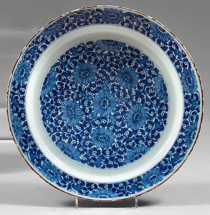 DELFT Earthenware dish decorated in blue monochrome with peonies on a background...