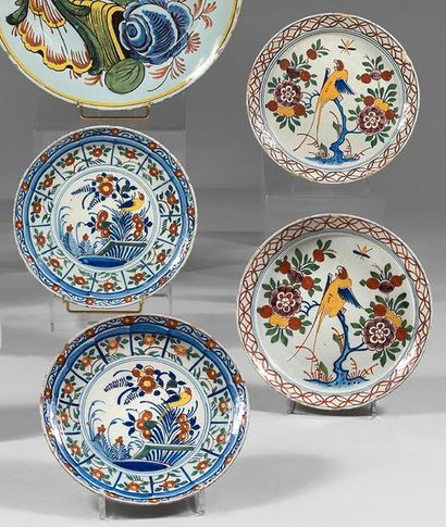 DELFT Two pairs of earthenware plates with polychrome decoration of parrots and budgies...