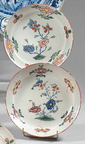 DELFT Suite of three earthenware plates with polychrome decoration of flowers.
Blue...