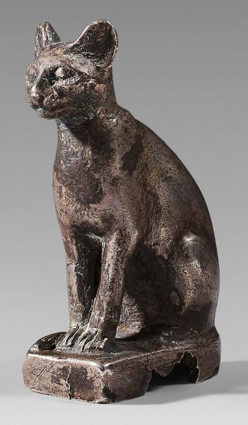 null Statuette of Bastet cat sitting with her tail folded along the front legs.
Silver....