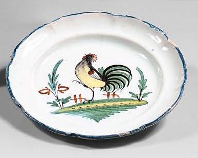 NEVERS et WALLY Four earthenware plates with contoured edges, with different polychrome...
