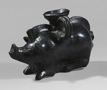  Plastic vase in the shape of a lying boar. Black glazed terracotta. (Small varnish...