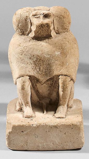  Statuette of a Thoth baboon sitting with his hands on his knees. It rests on a thick...