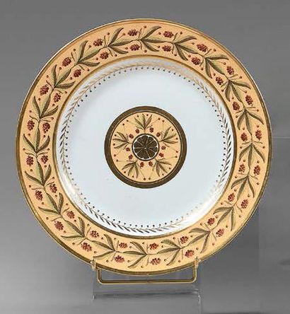 SÈVRES Hard porcelain plate with polychrome and gold decoration on a nanking background,...