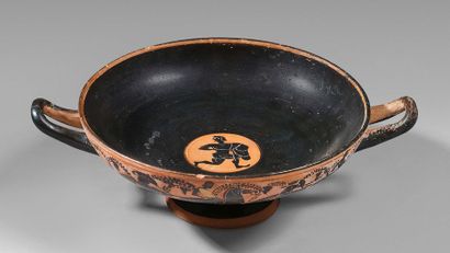 null Cup with black figures decorated with a frieze of horsemen framed under the...