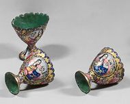 null Three zarfs with honeycombed edges with enamelled decoration, Iran 19th century
Roundels...