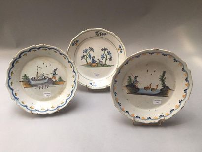 NEVERS Three earthenware plates with contoured edges with polychrome decoration of...